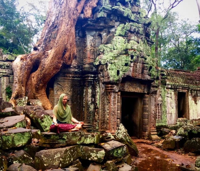 Woman meditating at Ankor Wat